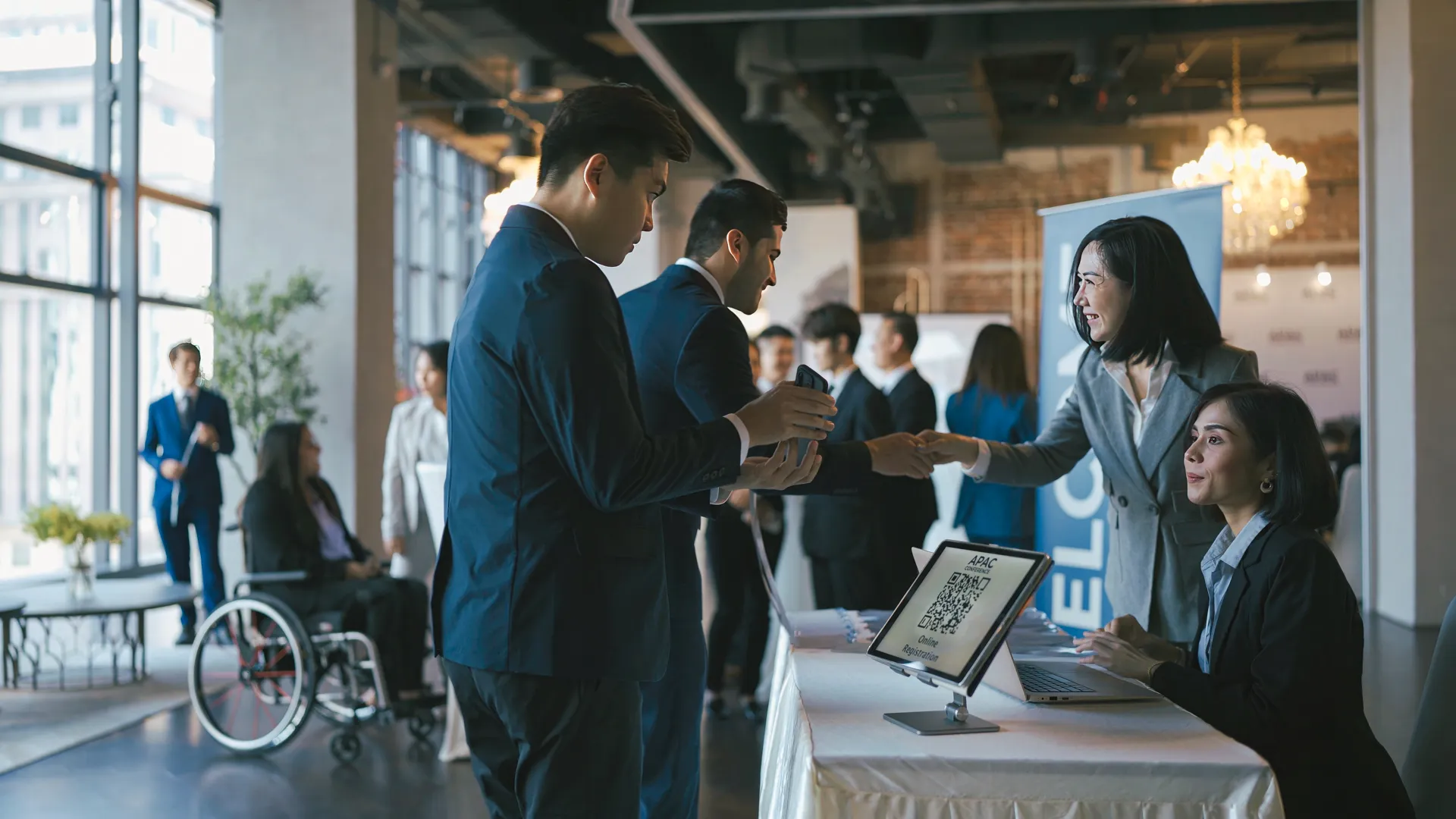 Visitor checking in with QR code at a reception desk in Malaysia